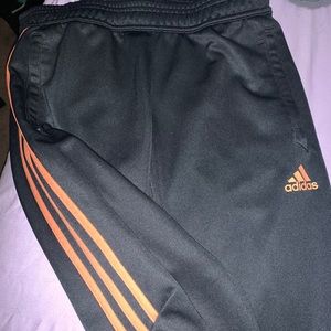 orange stripe adidas pants
